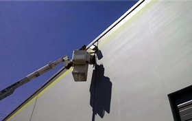 Commercial lighting repair using bucket truck - Seattle